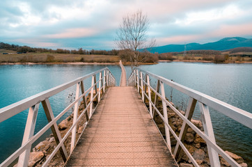 Fototapeta na wymiar floating bridge in the reservoir of Ullibarri Gamboa, Alava, Basque Country