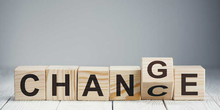 Naklejki Wooden blocks with letters forming words "Chance" and "Change" on neutral background