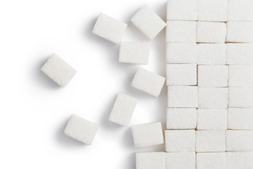 Fototapeta na wymiar White sugar cubes, isolated on white background, view from above with copy space