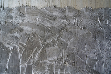concrete wall comb surface prepared for tiling