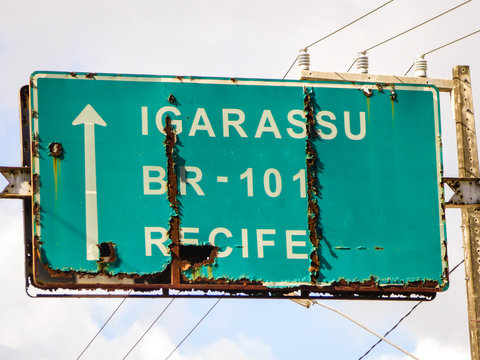 Ilha de Itamaraca, Brazil - Circa December 2018: Road sign giving directions to landmarks and cities nearby on Itamaraca Island