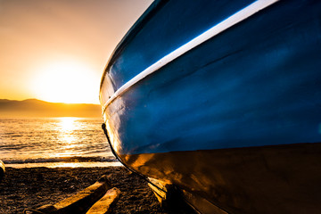 fishing boats along the seafront of Reggio Calabria at sunset - obrazy, fototapety, plakaty