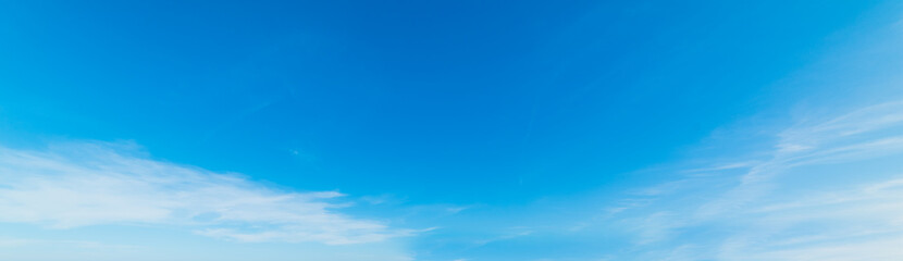 Fototapeta premium Small white clouds and blue sky