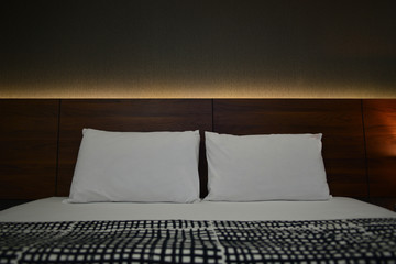 Close-up double bed in bedroom a hotel