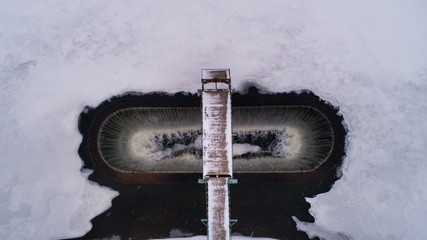 Oval dam on the lake in winter, Ukraine, Rivnenska region