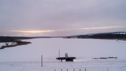 Oval dam on the lake in winter, Ukraine, Rivnenska region