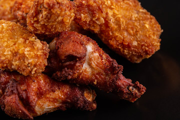 Legs chicken and chicken wings with ketchup breaded