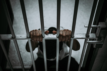 Hands of men desperate to catch the iron prison,prisoner concept,thailand people,Hope to be free.