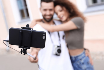 Fototapeta na wymiar Happy traveling couple making selfie, romantic mood.