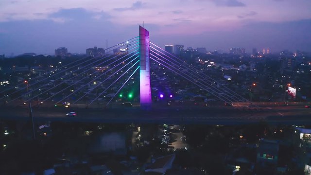 Bandung, Indonesia - January 02, 2019: Beautiful aerial view of Pasupati Bridge at dust time in Bandung city, West Java, Indonesia. Shot in 4k resolution