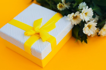 gift box flowers yellow ribbon