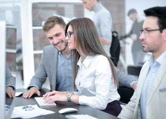 group of business people sitting at the office table