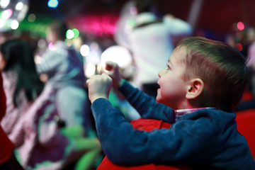 Smiling boy in concert hall