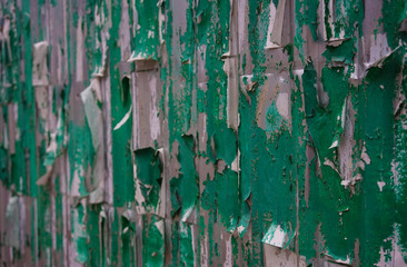 metal wall with peeling posters