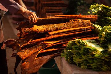 Cinnamon bark at a local market in Laos. - obrazy, fototapety, plakaty