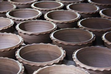 Traditional Thai-Mon pottery in sunlight for natural drying.