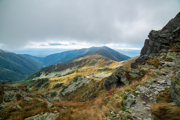 rocky Tatra mountain tourist hiking trails under blue sky in Slovakia