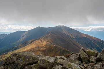 rocky Tatra mountain tourist hiking trails under blue sky in Slovakia