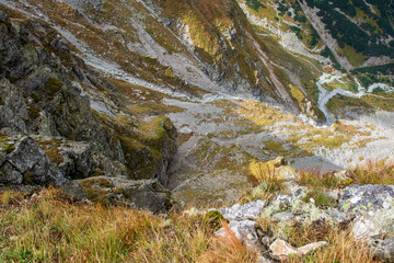 rocky Tatra mountain tourist hiking trails under blue sky in Slovakia