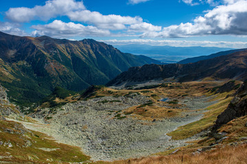 rocky Tatra mountain tourist hiking trails under blue sky in Slovakia
