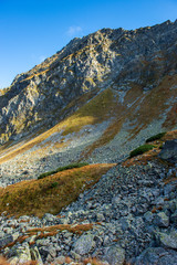 rocky Tatra mountain tourist hiking trails under blue sky in Slovakia
