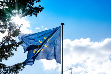 ANNECY, France - September 7 2018:European flag waving near Lac d'Annecy. Located in the Auvergne-Rhône-Alpes region in southeastern France, Annecy is often called the Venice of the Alps
