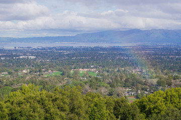 View towards south San Francisco bay after a storm; landscape with rainbow, California