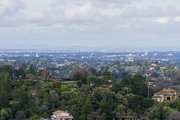 Panoramic view of the Peninsula on a cloudy day; view towards Los Altos, Palo Alto, Menlo Park, Silicon Valley and Dumbarton Bridge and San Francisco in the background, San Francisco bay, California
