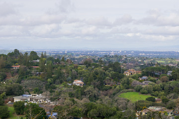 Panoramic view of the Peninsula on a cloudy day; view towards Los Altos, Palo Alto, Menlo Park, Silicon Valley and Dumbarton Bridge and San Francisco in the background, San Francisco bay, California