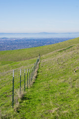 Fototapeta na wymiar Cattle fence in Mission Peak Regional Park, east San Francisco bay, California