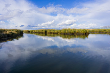 Clouds reflected in the salt ponds of Don Edwards Wildlife Refuge, south San Francisco bay, Alviso, San Jose, California