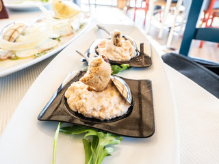 two delicious portions of fish mousse, with crumbled tarallo, in Italian restaurant