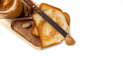 peanut butter on a slice of Toast. Isolated on a white background