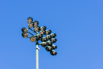 Fototapeta premium Stadium reflector lights on dark blue sky