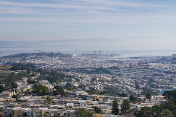 Fototapeta na wymiar View towards San Francisco bay from Mt Davidson on a foggy day, California
