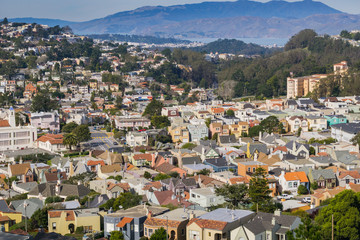 Fototapeta na wymiar Aerial views of residential areas of San Francisco, Marin county and the bay in the background, California