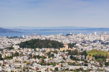 Fototapeta na wymiar Aerial view of residential areas of San Francisco; San Francisco bay and Alcatraz island in the background, California