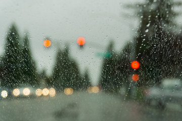 Raindrops on the windshield while driving on a rainy day, California