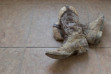 Muddy cowboy boots