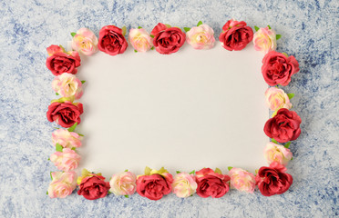 Floral pattern frame made of roses on white and black background. Flat lay, top view. Valentine's background. International Woman's day , 8 march Pattern of flowers. Flowers pattern texture 