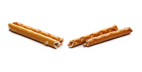 Salty cracker pretzel sticks isolated on white background