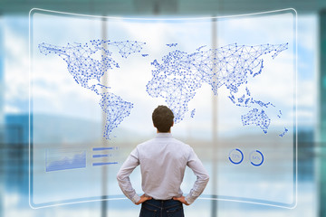 Global business network with connected lines on world map, worldwide data telecommunication for internet of things, fintech, and blockchain technology, concept with businessman analyzing dashboard