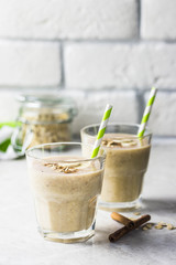 Peanut butter oatmeal breakfast smoothie. Selective focus, space for text.