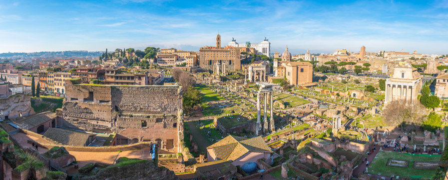 Ancient ruins of Forum panorama in a sunny day in Rome, Italy.