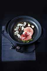 electric pan meat skillet pot connector plug food fry electrical adjustable onion black brown background table