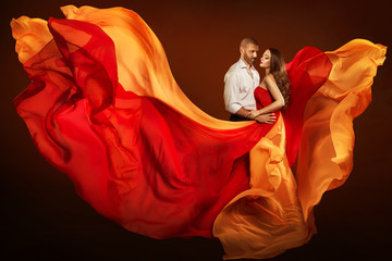 Couple Beauty Portrait, Dating Man and Dreaming Woman in Waving Flying Dress as Flame on Wind