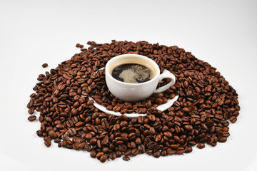 Cup of coffee and coffee beans.