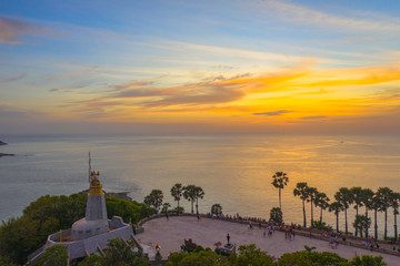 sunset above the great lighthouse at Promthep cape Phuket Thailand