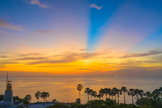 sunset above the great lighthouse at Promthep cape Phuket Thailand