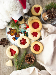 homemade linzer cookies heart-shaped and decorations on wooden table free space for text - holidays, winter, celebration, Valentine's day concept